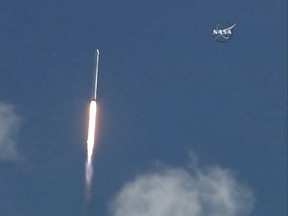 This June 28, 2015 grab from NASA TV shows the SpaceX Falcon 9 rocket with the unmanned Dragon cargo capsule on board shortly after launching from Cape Canaveral, Florida. AFP PHOTO / HANDOUT / NASA TV