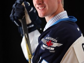17th overall pick Kyle Connor of the Winnipeg Jets poses for a portrait during the 2015 NHL Draft at BB&T Center on June 26, 2015 in Sunrise, Florida. (Mike Ehrmann/Getty Images/AFP)