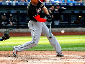 Miami Marlins right fielder Giancarlo Stanton (27) hits a two run home run in the fourth inning against the New York Mets at Citi Field. (Andy Marlin-USA TODAY Sports)