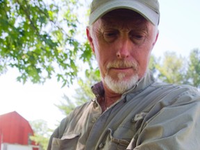 Brian Salt, founder of Salthaven Wildlife Rehabilitation and Education Centre in Mt. Brydges, holds an endangered Eastern foxsnake. (MIKE HENSEN, The London Free Press)