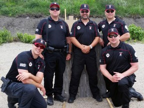 Kingston Police Force's Police Action Pistol team, from left, Const. Andrew Sullivan, Const. Scott Shultz, coach Mark Nichol,  Const. Zane Brillinger and Const. Rob Davidson will compete at the World Police and Fire Games in Fairfax, Va. (Steph Crosier/The Whig-Standard)
