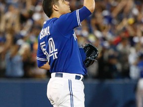 Blue Jays reliever Roberto Osuna reacts after striking out Mitch Moreland for the final out of his team's 3-2 victory over the Texas Rangers in Toronto, Ont. on June 28, 2015. (MICHAEL PEAKE/Toronto Sun)