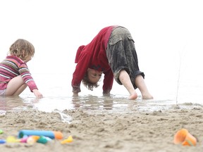 Ethan and Brenna Keen play in the water at Birds Hill Provincial Park last year. Premier Greg Selinger announced Monday that the beach would be expanded by 50%. (Kevin King/Winnipeg Sun file photo)