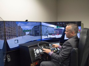 AMTA board chairman, Dan Duckering, demonstrates the AMTA’s Truck Simulator at the AMTA Edmonton office. The Simulator is used to train new drivers in a variety of situations.