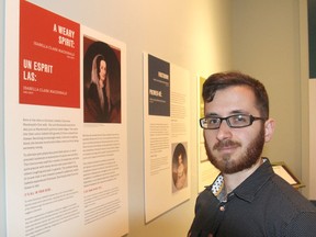 Maxime Chouinard, curator of the Museum of Health Care in Kingston, stands in front of part of a new exhibit that looks at the illnesses that affected the family of Sir John A. Macdonald and the role he played in health care in the city. (Michael Lea/The Whig-Standard)