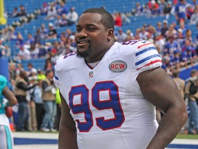 Buffalo Bills defensive tackle Marcell Dareus helmetless in white game-day uniform before a game against the Miami Dolphins in this September 2014 file photo. (John Kryk/Postmedia Network)