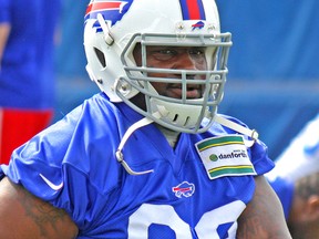 Marcell Dareus of the Buffalo Bills stretches before the team's final spring practice on June 18, 2015. (John Kryk/Postmedia Network)