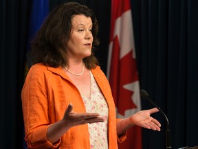 Jobs, Skills, Training and Labour Minister Lori Sigurdson announces that Alberta's minimum wage will increase from $10.20 to $11.20 as of Oct. 1., during a press conference at the Alberta Legislature in Edmonton Alta. on Monday June 29, 2015. David Bloom/Edmonton Sun