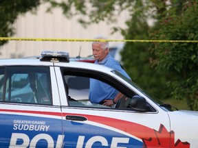 Gino Donato/The Sudbury Star
In this file photo, Staff Sgt. Al Asunmaa of the Greater Sudbury Police Service talks with an officer at a road block on Spruce Street.