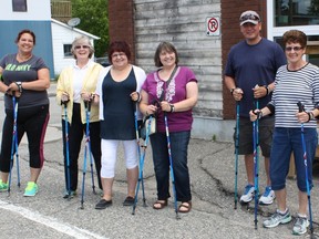 Brandi Pollari, Sharon Martin, Jeanette deBlois, Mae Demers, Stewart McLeod and Yvonne Langlois get ready to head out for their Nordic Pole walk on June 24.