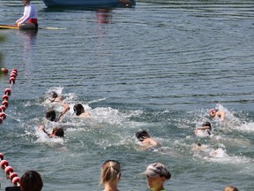 And they're off, the kid's division of the Try-a-tri triathlon on their way in the swim part of the event.