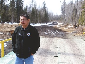 Shoal Lake 40 Chief Erwin Redsky at the temporary metal bridge that spans the canal that has isolated his community for almost a century. A Kickstarter fundraising campaign has started to help pay for an all-weather road on the reserve. (FILE PHOTO)