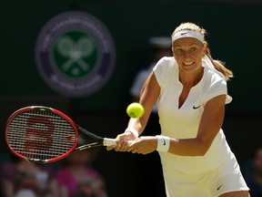 Petra Kvitova hits a shot during her first-round match against Kiki Bertens during Wimbledon in London, June 30, 2015. (REUTERS/Henry Browne)