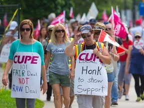 Large numbers of CUPE Local 101 picketers fill the sidewalks in front of London's city hall in London, Ont. on Monday June 29, 2015. Strikers explained that they had to fit five days of picketing into four days this week due to Canada Day, and thus more have been scheduled for the morning and afternoons. (MIKE HENSEN, The London Free Press)
