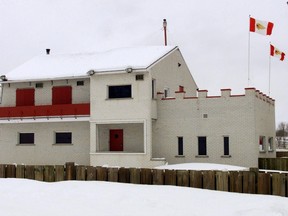 The former Hells Angels stronghold in a town halfway between Montreal and Quebec City is being demolished. The flags of the Hells Angels biker gang fly over their fortified bunker in Trois Rivieres, Que., Wednesday March 28, 2001. THE CANADIAN PRESS/Ryan Remiorz