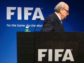 FIFA president Sepp Blatter leaves after his statement during a news conference at the FIFA headquarters in Zurich, Switzerland, June 2, 2015. (REUTERS/Ruben Sprich)