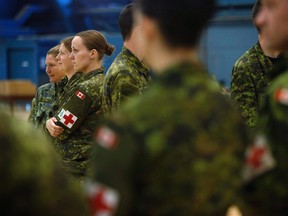 A six-month mission that sent Canadian Armed Forces medical personnel to West Africa to help with the Ebola response has wound up, the federal government announced Tuesday. Soldiers returning from a medical mission in Sierra Leone wait for their medical assessments at the Ottawa International Airport on March 6, 2015. THE CANADIAN PRESS/Cole Burston