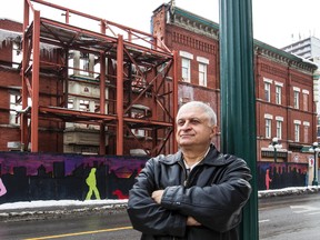 Tony Shahrasebi across the street from the building he owns at the corner of Bank Street and Somerset Street in Ottawa. December 5,2013. Errol McGihon/Ottawa Sun files