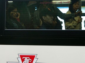 TTC Subway riders scramble to get on a Shuttle Bus at Keele Station after a Subway shutdown in Toronto on Tuesday September 30, 2014. Dave Abel/Toronto Sun/QMI Agency