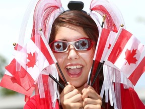 Katrina Nabozniak is excited about the Canada Day celebrations going on throughout the city wednesday in Calgary on Tuesday June 30, 2015. Darren Makowichuk/Calgary Sun/Postmedia Network