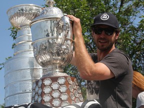 Kenora hockey product Mike Richards, pictured with the Stanley Cup last August long weekend in Kenora, had his contract with the Los Angeles Kings terminated on Monday. (Lloyd Mack/Postmedia Network/Files)