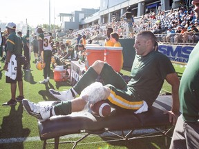 Mike Reilly ices his knee following the Cleyon Laing hit during Saturday's game against the Argonauts in Fort McMurray. (Amber Bracken, Canadian Press)