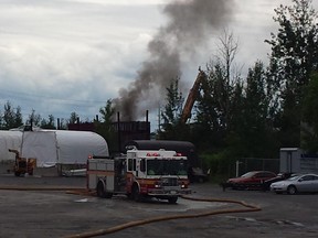 Ottawa firefighters are dousing a fire in a garbage container near a scrapyard in Nepean.A loud bang shook the area around Bentley Ave. and Merivale Rd. at 3 p.m.Thick black smoke billowed into the sky for about an hour while firefighters brought the blaze under control. Corey Larocque, Ottawa Sun