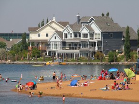 Summerside residents enjoy their private lake at Grande Blvd and 88 St., in south Edmonton on July 3, 2014. Summerside is the first neighbourhood in Edmonton to come with a private swimmable Lake exclusively for its residents, the 10-acre Lake Summerside Beach Club features a clubhouse, tennis courts, beach volleyball courts, fishing dock, marina, family picnic area, sledding hills, playground, and beach and during the winter it has a skating rink. Darcy Gerhard/Edmonton Sun Reader Photo