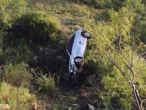 This photo provided by Brandon Cogburn, shows the wrecked car of Wanda Mobley where she was found Sunday, June 28, 2015, near Seymour, Texas. The 75-year-old woman says she couldn't walk after crashing her car into a ravine in North Texas, but survived for two days after pulling herself through a broken windshield and soaking her T-shirt in a nearby pond to get water. Brandon Cogburn via AP