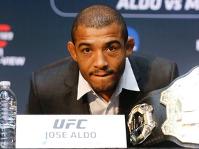 MMA fighter Jose Aldo talks at a press conference at the Eaton Centre in Toronto to promote his UFC 189 fight in Las Vegas on March 27, 2015. (Michael Peake/Toronto Sun)