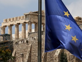 A European Union flag flutters before the temple of Parthenon at the Acropolis hill in Athens, Greece. (REUTERS)