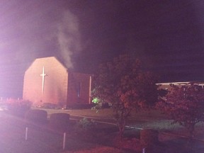 Smoke rises from Mount Zion African Methodist Episcopal church near Greeleyville, S.C., which caught fire Tuesday, June 30, 2015. Firefighters are trying to extinguish the blaze at the prominent black church. (Veasey Conway/The Morning News via AP)