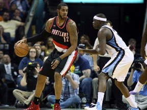 Portland Trailblazers forward LaMarcus Aldridge (12) backs in against Memphis Grizzlies forward Zach Randolph (50) in the first quarter during game five of the first round of the NBA Playoffs at FedExForum April 29, 2015 in Memphis. (Nelson Chenault-USA TODAY Sports)
