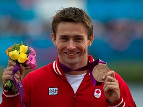 Canada's Mark Oldershaw celebrates bronze in the men's 1000-metre canoe single (C1) final at Eton Dorney during the 2012 Summer Olympics in Dorney, England on Friday, August 8, 2012.  (THE CANADIAN PRESS/Sean Kilpatrick)