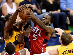DeMarre Carroll #5 of the Atlanta Hawks goes up with th ball against Tristan Thompson #13 of the Cleveland Cavaliers in the first half during Game Four of the Eastern Conference Finals of the 2015 NBA Playoffs at Quicken Loans Arena on May 26, 2015 in Cleveland, Ohio. (Jason Miller/Getty Images/AFP)