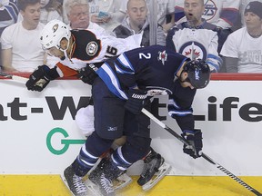 The Winnipeg Jets have signed defenceman Adam Pardy (right) to a one-year, one-way deal worth $1 million. (file photo)