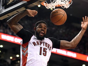 Toronto Raptors forward Amir Johnson (15) reacts after dunking the ball for a basket during the second half of the Raptors 105-100 win over Minnnesota Timberwolves at Air Canada Centre March 18, 2015. (Dan Hamilton-USA TODAY Sports)