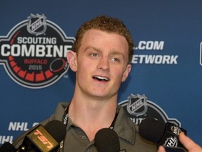 Jack Eichel reacts to a question at a news conference during the NHL Combine in Buffalo on June 5, 2015. Eichel signed his first professional contract on Wednesday, opting to skip his final three years of college eligibility. (THE CANADIAN PRESS/AP/Gary Wiepert)