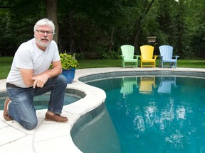 Hollandia Pools and Spas president and CEO Walter Schmoll poses for a photo next to the pool outside his home. (CRAIG GLOVER, The London Free Press)