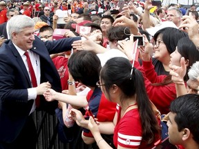 Canada's Prime Minister Stephen Harper greets spectators during Canada Day on Parliament Hill in Ottawa July 1, 2015. REUTERS/Patrick Doyle