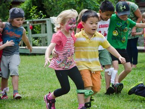 Katie Raynard, 4, and Pollock Vien, 5, take a quick lead during the three-legged race during the Canada Day celebrations at the Kootenai Brown Pioneer Village Museum in Pincher Creek. John Stoesser photos/Pincher Creek Echo.