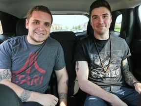 Michael Burton and Kris Chaput, of Georgetown on Wednesday July 1, 2015, are offering their services to be passengers in your car to use the Pan Am HOV lanes. (Veronica Henri/Toronto Sun)