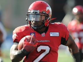 Jack Sanders runs with the ball against the Ottawa RedBlacks during CFL action in Calgary, Alta. on Saturday August 9, 2014. Stuart Dryden/Calgary Sun/QMI Agency