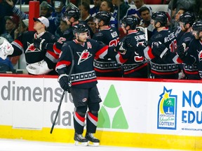 Dec 18, 2014; Raleigh, NC, USA; Carolina Hurricanes defensemen Andrej Sekera celebrates his 3rd period goal with teammates against the Toronto Maple Leafs at PNC Arena. The Carolina Hurricanes defeated the Toronto Maple Leafs 4-1. Mandatory Credit: James Guillory-USA TODAY Sports