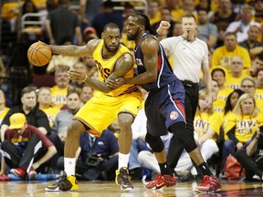 DeMarre Carroll leans in on LeBron James during the Eastern Conference final. (AFP)