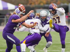 Laurier kicker Ronnie Pfeffer, getting off a punt against Western, has been summoned to fill in for injured Swayze Waters when the Argos take on the Roughriders in Regina on Sunday. (MIKE HENSEN, Postmedia Network)