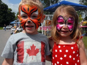 Liam Cornet, 3, and Aubrey Adams, 3, celebrate Canada Day with brightly painted faces. Donning the requisite red and white, the two took in the sights and sounds at Pinafore Park Wednesday.