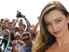 Miranda Kerr unveils the new Magnum 'Pink & Black' ice cream, at the 68th Annual Cannes Film Festival. (WENN.com)