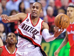 Portland Trail Blazers guard Arron Afflalo (4) shoots over Los Angeles Clippers guard Chris Paul (3) during the second quarter at the Moda Center. Craig Mitchelldyer-USA TODAY Sports