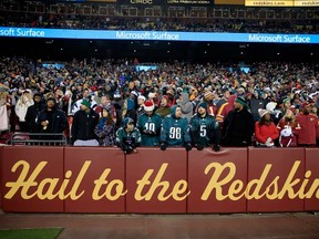 Philadelphia Eagles fans look on after the Washington Redskins defeated the Philadelphia Eagles 27-24 at FedExField on December 20, 2014 in Landover, Maryland. (Rob Carr/Getty Images/AFP)